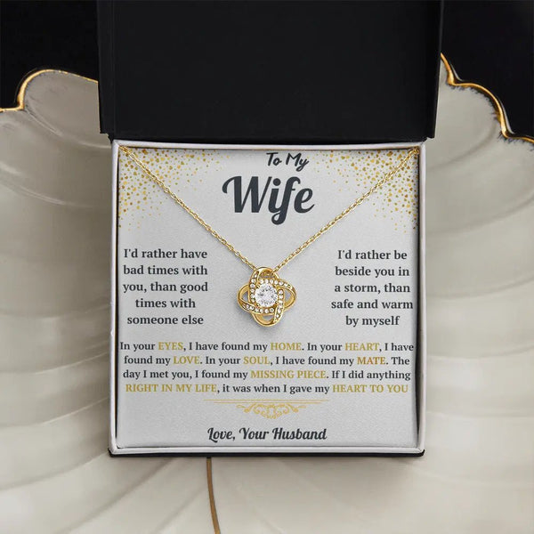 Gold necklace with sentimental message card for wife on a white background