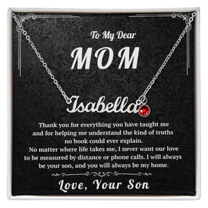 Necklace with a red heart pendant on a black card with personalized text for a mother.