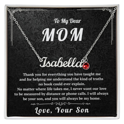 Necklace with a red heart pendant on a black card with personalized text for a mother.